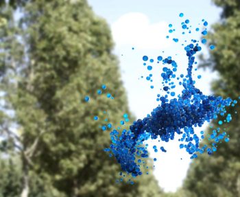 Blue beads hang in the air in front of some trees